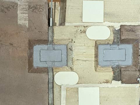 Section of a parking garage wall that looks like a work of abstract modern art