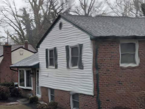 A house appearing to be melting in the rain