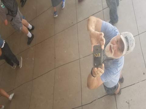 Photo of the reflection of me taking the photo of me that is on the surface of the 