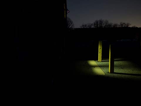 Yellow pencil laying in the grasTwo yellow rectangular metal posts standing guard outside of a schoolyard door