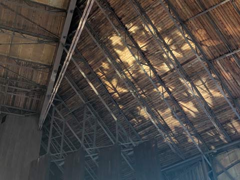 Star shaped lights shining on the rafters and wooden roof of the Mann Music Center